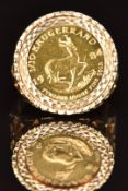 A 9ct gold ring set with a 1984 gold 1/10 Krugerrand, 6.8g, size O/P