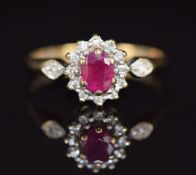 A 9ct gold ring set with a ruby and diamonds, 1.6g, size L