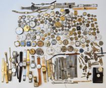 A large collection of pocket and wristwatches, parts, movements and dials including Tudor, Roamer,
