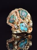A 1970s 9ct gold ring set with three turquoise boulders in an abstract cage mount, Birmingham