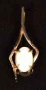 A 9ct gold pendant set with an opal, 0.5g