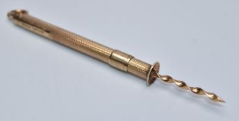 9ct gold toothpick with engine turned decoration, length when extended 8.5cm, weight 4.1g