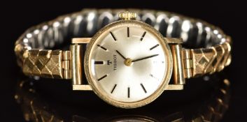 Tissot 9ct gold ladies wristwatch with black hands and baton hour markers, silver dial and signed 17