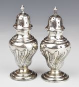 Victorian pair of hallmarked silver peppers, Chester 1900, maker Cohen & Charles, height 10cm,