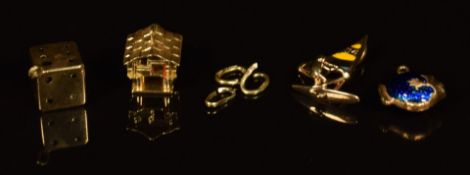 An 18ct gold charm / pendant in the form of a windsurfer set with enamel, 18ct gold charm in the