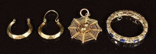 A 9ct gold eternity ring set with paste, 14k gold pendant in the form of a spider and web and 9ct