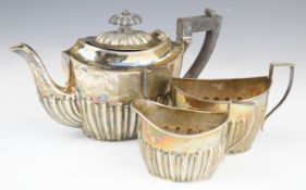 Victorian hallmarked silver three piece bachelor's teaset with reeded lower body, Birmingham 1896,