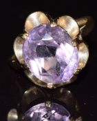 A 9ct gold ring set with an oval cut amethyst, 3.3g, size L
