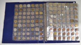 A collection of world coins contained in a Change Checker album