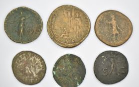 Six Roman copper / bronze follis and other coins including Claudius and Diocletian, smallest 27mm