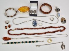 A collection of jewellery including silver pendant and earrings set with amber, silver bracelets,