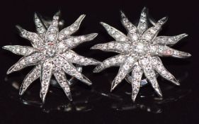 Tiffany & Co pair of platinum earrings set with diamonds in a starburst design, the total diamond