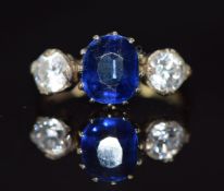 A 9ct gold ring set with a sapphire of approximately 1.5ct and cubic zirconia, 2.3g, size K