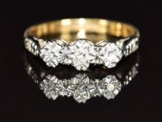 An 18ct gold ring set with diamonds in a platinum setting, 3g, size M