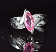 An 18k white gold ring set with a pink Ceylon sapphire and diamonds, 4.7g, size N