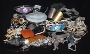 A collection of jewellery including moss agate brooch, agate plaques, three silver rings, a silver