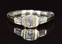 An 18k white gold ring set with four baguette cut and two princess cut diamonds, 2.7g, size I/J