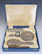 Broadway hallmarked silver dressing table set in original box, comprising hand mirror two brushes