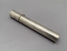 A cylindrical silver toothpick holder