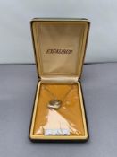 A rolled gold heart shaped locket on chain