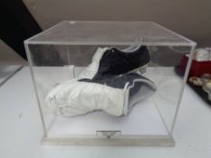 A pair of signed Albert Luque football boots in display case