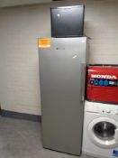 A Hotpoint upright freezer together with a Russell Hobbs bench top fridge