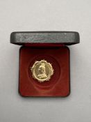 An 1887 jubilee shilling in brooch mount