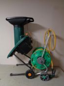 A Performance 1800W chipper shredder together with a Hozelock hosepipe on reel