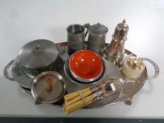 A silver plated twin-handled serving tray on claw and ball feet, plated wares, fish cutlery,