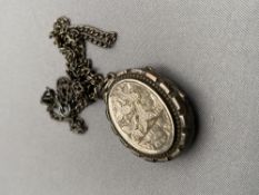 A vintage silver locket on chain