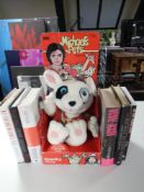 A tray of six books relating to Michael Jackson one signed by Germaine Jackson,