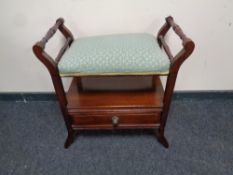 An Edwardian mahogany adjustable piano stool