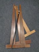 Four draftsman's T-squares together with a walking cane with silver pommel