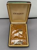 A rolled gold heart locket on chain