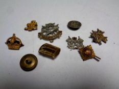 A bag containing a quantity of World War II era military badges