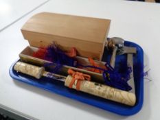 A Japanese knife with a carved resin handle and sheath,