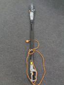 A Titan electric pole saw