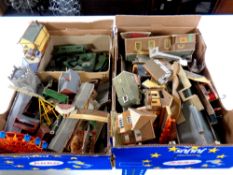Two boxes containing a quantity of model railway buildings
