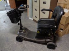 A mobility scooter with keys and charger