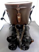 A leather cased set of 10x50 field glasses by Ross of London together with a Ricoh 500 GX camera in