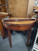 A George III mahogany turnover top table