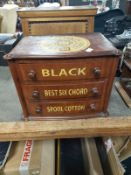 A Victorian mahogany three drawer miniature chest bearing haberdashery decoration