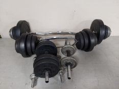 Four dumbbells and two barbells together with various weights