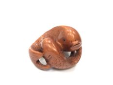 A Chinese hardwood netsuke - Two Carp.