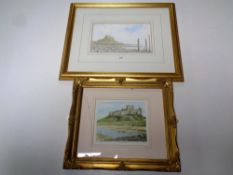 A James Slater watercolour of Lindisfarne together with a further limited edition print of Bamburgh