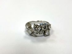 An 18ct white gold eight stone diamond ring, the total diamond weight estimated at 1.