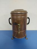 A copper water urn