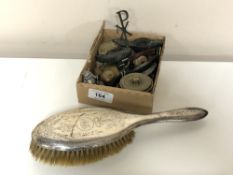 A silver backed dressing table brush together with a box containing lady's wristwatch, carvings,