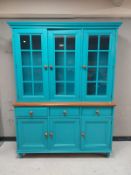 A contemporary kitchen dresser fitted cupboards and drawers beneath