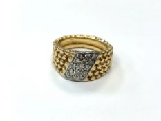 An 18ct gold textured, diamond set ring, size M. CONDITION REPORT: 9.